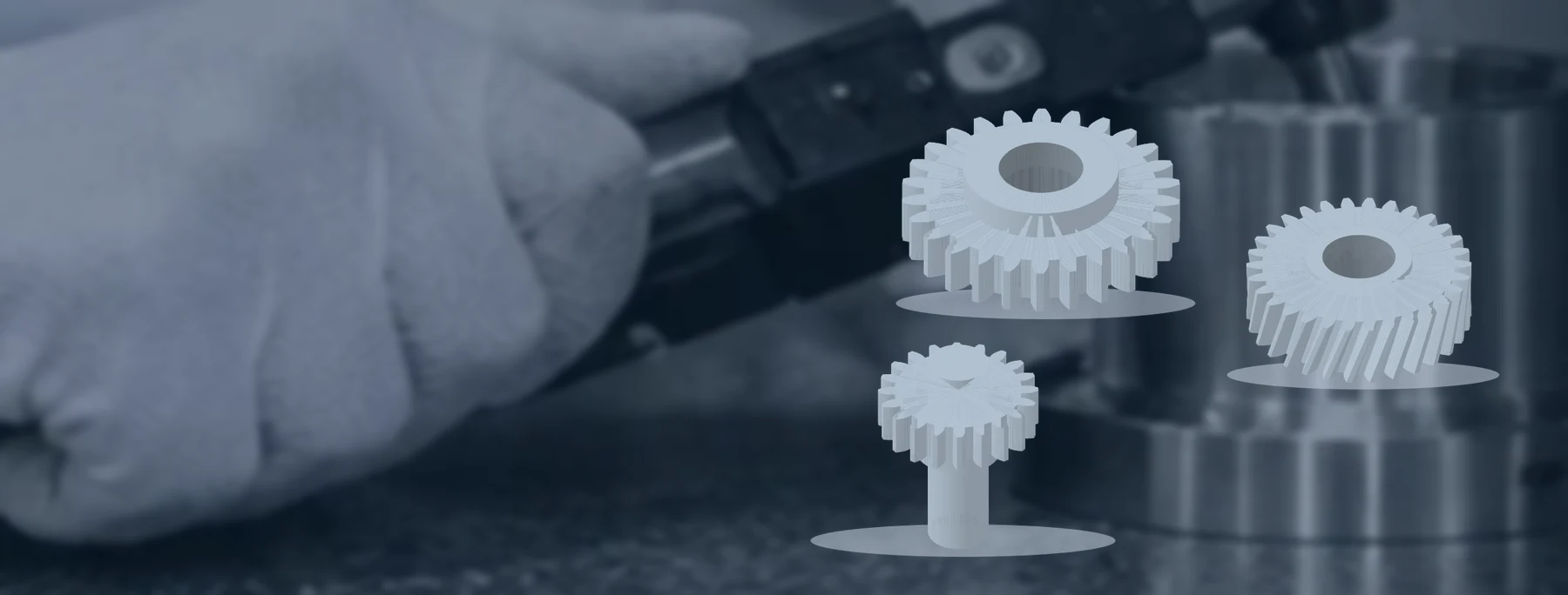 Spur and helical gears with a pinion shaft against an inspection-workspace background