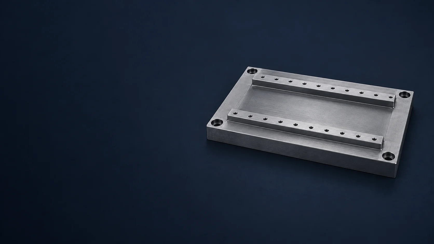Machined machine base plate with two rail mounting lands and bolt holes