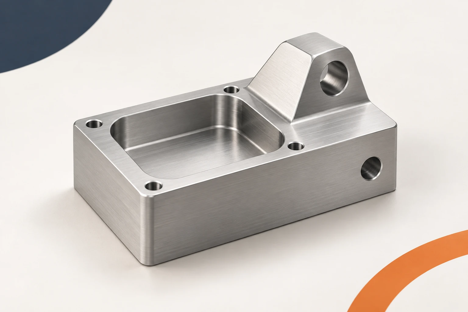 Machined housing with a top pocket and holes on its upper and side features.