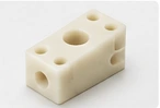 Illustrative drilled guide block — AI illustration, not a vetcnc production photograph