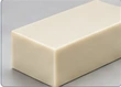 Beige polymer stock shape — AI illustration, not a vetcnc production photograph