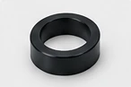 Illustrative black annular spacer geometry — AI illustration, not a vetcnc factory photo or a verified nylon sample