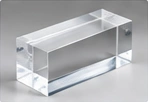 Clear machined housing — AI illustration, not a vetcnc photograph or a verified PMMA sample